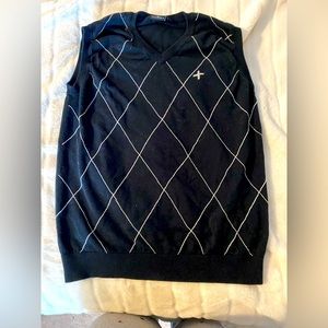 Large black sweater vest.